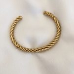 Pulseira em Aço Dourada Torcida