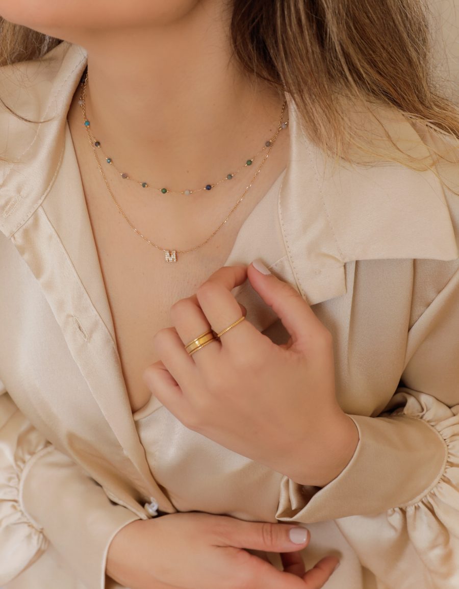 Colar em Aço Dourado com Letra de Zircónias